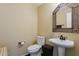 Updated bathroom with pedestal sink and decorative mirror at 11022 N Indigo Dr # 121, Fountain Hills, AZ 85268