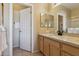 Bathroom with light wood cabinets and granite countertop at 11022 N Indigo Dr # 121, Fountain Hills, AZ 85268