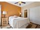 Bedroom with orange accent wall and en-suite bathroom at 11022 N Indigo Dr # 121, Fountain Hills, AZ 85268