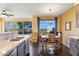 Kitchen dining area with wooden table and chairs, and scenic views at 11022 N Indigo Dr # 121, Fountain Hills, AZ 85268