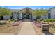 Elegant clubhouse entrance with landscaping and brick walkway at 12059 N Luckenbach St, Surprise, AZ 85388