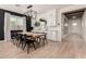 Modern dining room with a large wooden table and black chairs at 12059 N Luckenbach St, Surprise, AZ 85388