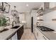 Modern kitchen with stainless steel appliances, large island, and white cabinets at 12059 N Luckenbach St, Surprise, AZ 85388