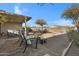 Relaxing backyard with patio furniture and gravel landscaping at 1272 E Dust Devil Dr, San Tan Valley, AZ 85143