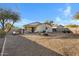 Large backyard with gravel landscaping and plenty of space at 1272 E Dust Devil Dr, San Tan Valley, AZ 85143