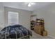 Guest bedroom with double bed and built-in shelving at 1272 E Dust Devil Dr, San Tan Valley, AZ 85143