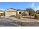 Single-story home with attached garage and desert landscaping at 1272 E Dust Devil Dr, San Tan Valley, AZ 85143