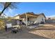 Covered patio with seating area and built-in grill at 1272 E Dust Devil Dr, San Tan Valley, AZ 85143