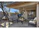 Relaxing covered patio with seating area, perfect for outdoor entertaining at 1272 E Dust Devil Dr, San Tan Valley, AZ 85143