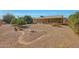 Spacious backyard with desert landscaping and rock pathway at 13226 W Mesa Verde Dr, Sun City West, AZ 85375