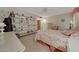 Bright bedroom featuring built-in shelves and floral bedding at 13226 W Mesa Verde Dr, Sun City West, AZ 85375