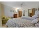 Bedroom with twin beds, an armchair, and a view of another room at 13226 W Mesa Verde Dr, Sun City West, AZ 85375