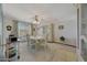 Bright dining room with a round table, chairs, and a china cabinet at 13226 W Mesa Verde Dr, Sun City West, AZ 85375