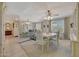 Bright dining room features a table with four chairs and a large mirror at 13226 W Mesa Verde Dr, Sun City West, AZ 85375