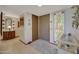 Entryway with tiled floors, stained glass window, and a console table at 13226 W Mesa Verde Dr, Sun City West, AZ 85375