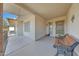 Covered front porch with a wooden bench, offering a welcoming entrance at 13226 W Mesa Verde Dr, Sun City West, AZ 85375