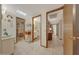 View down a hallway featuring access to bedrooms and bathrooms at 13226 W Mesa Verde Dr, Sun City West, AZ 85375