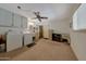 Clean laundry room with washer, dryer, and cabinets at 13226 W Mesa Verde Dr, Sun City West, AZ 85375