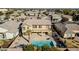 Aerial view highlighting the home's backyard oasis with a pool at 13611 W Merrell St, Avondale, AZ 85392