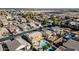 An aerial view showcasing a house with a pool in a neighborhood at 13611 W Merrell St, Avondale, AZ 85392