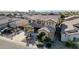 Two-story house with a three-car garage and desert landscaping at 13611 W Merrell St, Avondale, AZ 85392