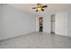 Bedroom with private bath access and ceiling fan at 13611 W Merrell St, Avondale, AZ 85392