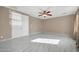 Spacious bedroom with ceiling fan and tiled floors at 13611 W Merrell St, Avondale, AZ 85392