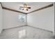 Charming bedroom with window, ceiling fan and marble floors at 13611 W Merrell St, Avondale, AZ 85392