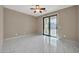 Bright bedroom with tiled floors and French doors at 13611 W Merrell St, Avondale, AZ 85392