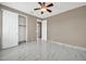 Well-lit bedroom featuring marble floors and ceiling fan at 13611 W Merrell St, Avondale, AZ 85392