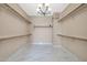 Spacious walk-in closet with built-in shelves and rods at 13611 W Merrell St, Avondale, AZ 85392