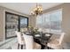 Elegant dining room features a marble table and chandelier at 13611 W Merrell St, Avondale, AZ 85392