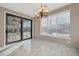 Bright dining room with marble floors and French doors at 13611 W Merrell St, Avondale, AZ 85392