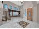 Elegant entryway with marble floors, staircase, and chandelier at 13611 W Merrell St, Avondale, AZ 85392