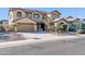 Two-story house with a three-car garage and desert landscaping at 13611 W Merrell St, Avondale, AZ 85392