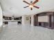 Bright living room with kitchen view and ceiling fan at 13611 W Merrell St, Avondale, AZ 85392