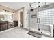 Spa-like bathroom with walk-in shower, double vanity, and marble floors at 13611 W Merrell St, Avondale, AZ 85392