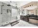 Elegant bathroom with large glass shower, double vanity, and marble floors at 13611 W Merrell St, Avondale, AZ 85392