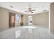 Bright main bedroom with marble floors and ensuite bathroom access at 13611 W Merrell St, Avondale, AZ 85392