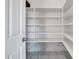 Large walk-in pantry with ample shelving at 13611 W Merrell St, Avondale, AZ 85392