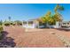 Home's backyard with gravel, plants, and solar panels at 14103 W Casa Linda Dr, Sun City West, AZ 85375