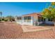 Backyard with sunroom and gravel landscaping at 14103 W Casa Linda Dr, Sun City West, AZ 85375