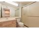 Bathroom with shower, single sink vanity, and tile floor at 14103 W Casa Linda Dr, Sun City West, AZ 85375