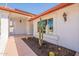 Inviting front entrance features desert landscaping and a covered walkway at 14103 W Casa Linda Dr, Sun City West, AZ 85375