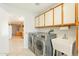 Laundry room with side-by-side washer and dryer, and utility sink at 14103 W Casa Linda Dr, Sun City West, AZ 85375