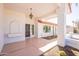 Covered porch with terracotta tile flooring and a ceiling fan at 14103 W Casa Linda Dr, Sun City West, AZ 85375