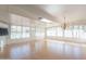 Sunroom addition with wood floors and chandelier at 14103 W Casa Linda Dr, Sun City West, AZ 85375