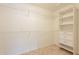 Large walk-in closet with shelving and drawers at 14103 W Casa Linda Dr, Sun City West, AZ 85375