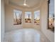 Neutral toned bedroom provides recessed lights, travertine floors, and backyard views at 15701 E Greystone Dr, Fountain Hills, AZ 85268