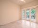 Bedroom with tile flooring and sliding glass door to the backyard at 15701 E Greystone Dr, Fountain Hills, AZ 85268